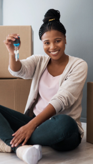 Smiling woman with keys to new home